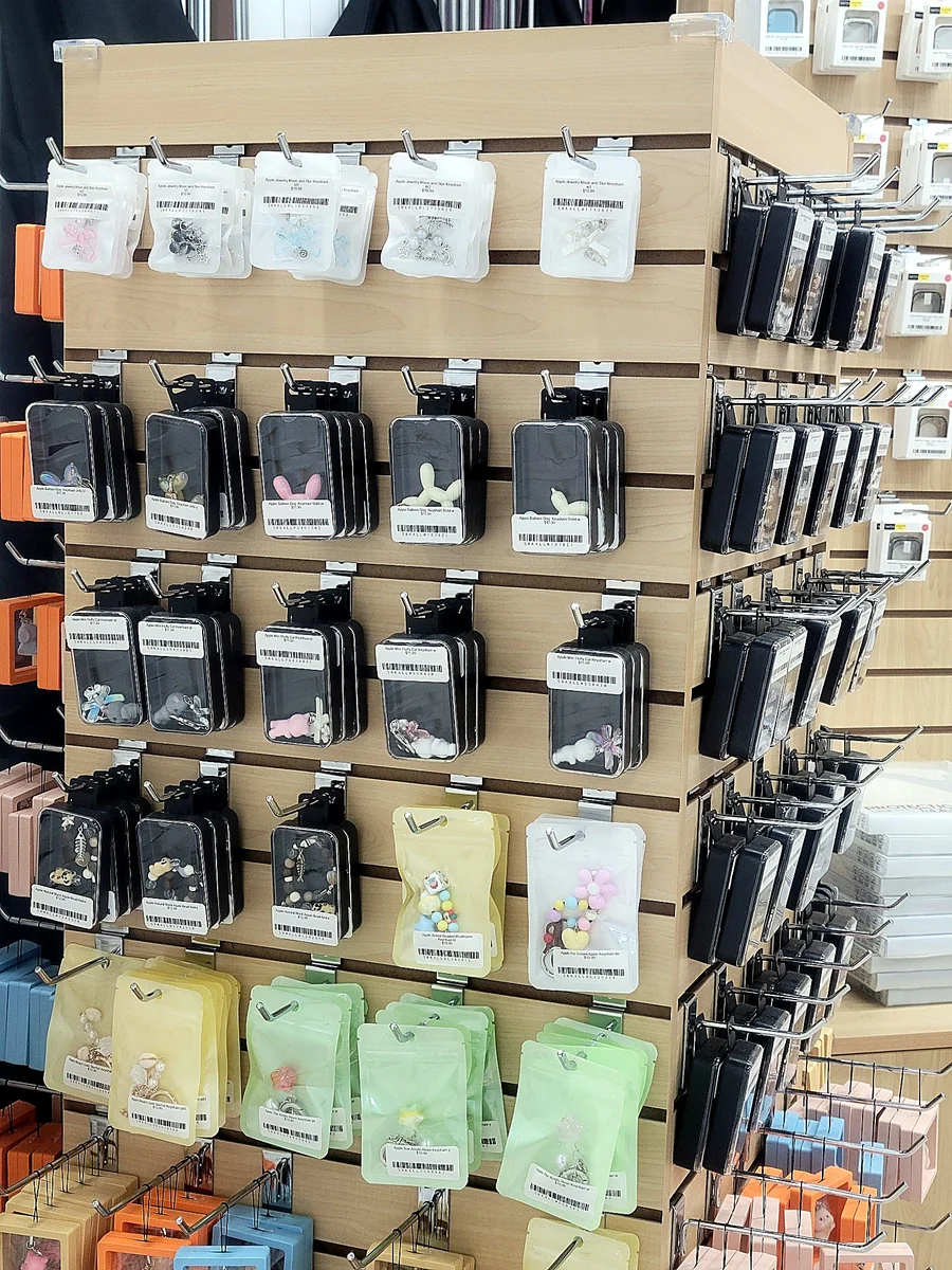 Accessory wall with packaged keychains and charms