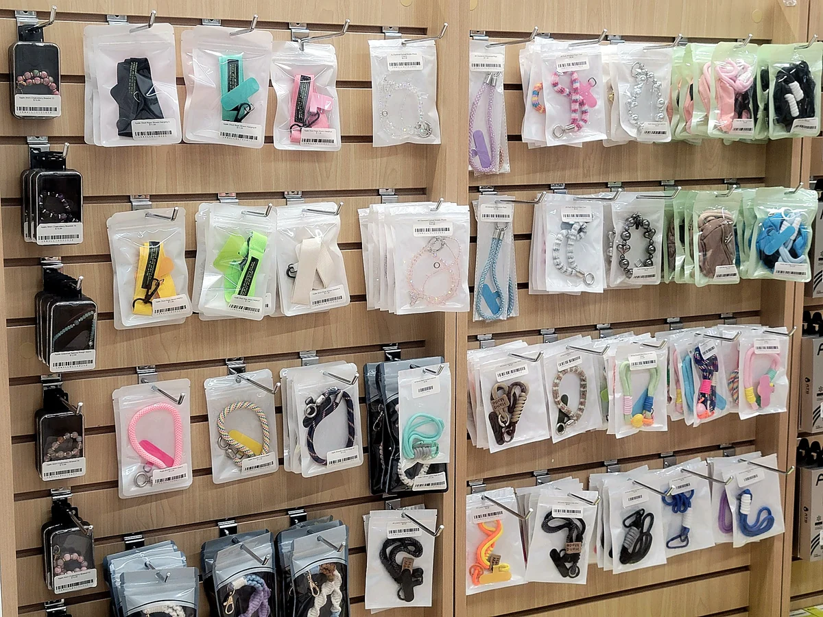 Display of wrist straps and charm accessories